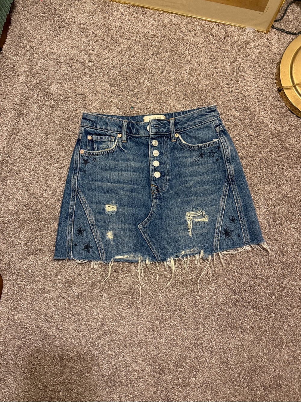 We The Free Distressed Denim Mini Skirt with Star Graphic Accents